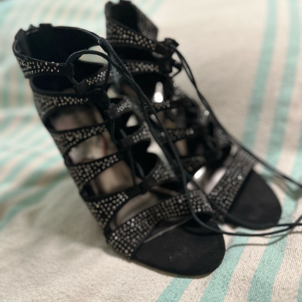 Madden girl studded black high heals. Lace up front and zip up back. worn twice